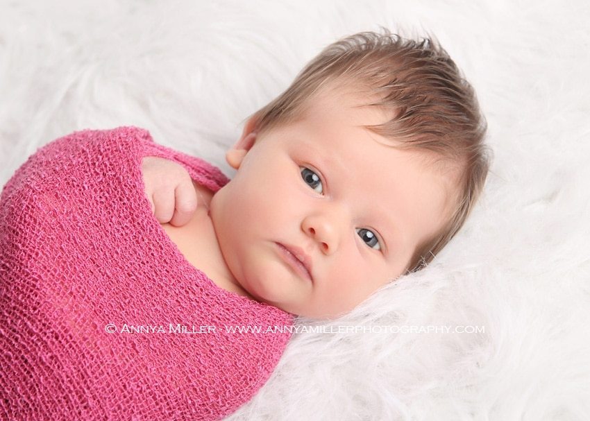 Brand new baby wrapped in pink by Durham Region photographer