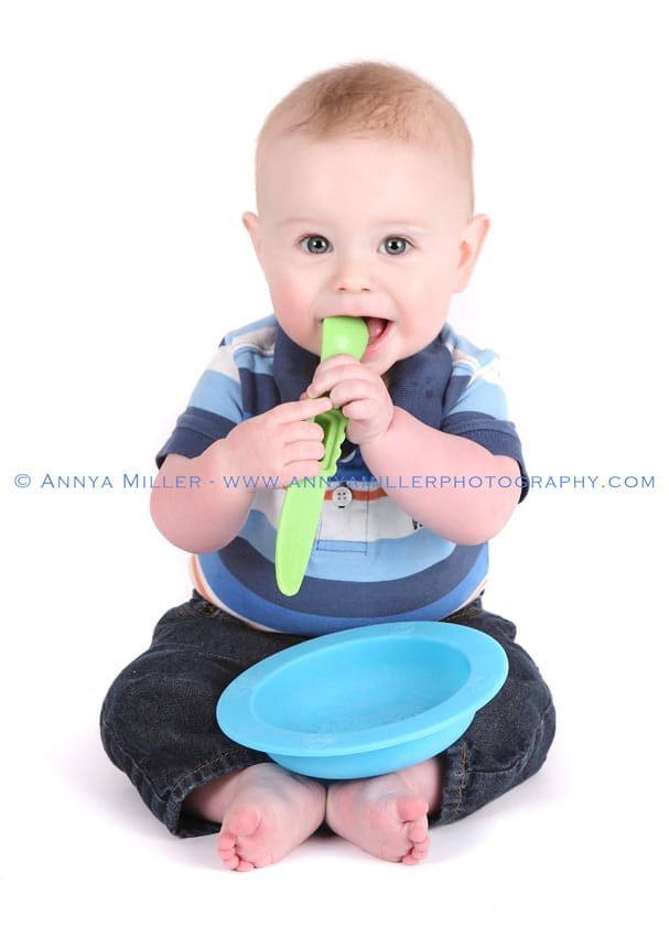 Baby chewing spoon by Pickering baby photographer Annya Miller