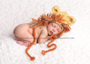 Durham region newborn photography of baby in lion hat