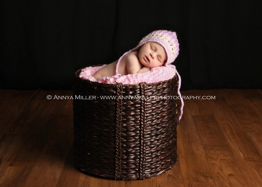 Toronto newborn photography of baby in basket.