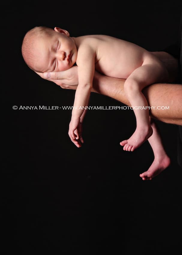 Durham region newborn photography of baby boy in Dad's arms
