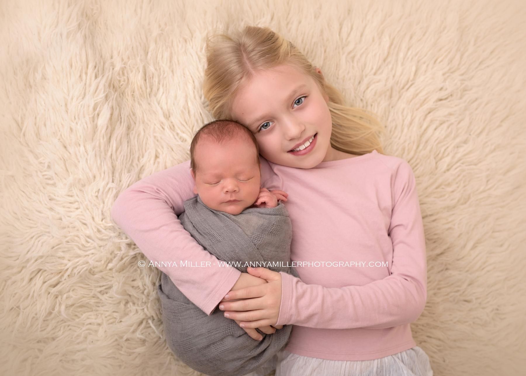 Newborn portrait of baby boy and big sister by Toronto newborn photographer Annya Miller 