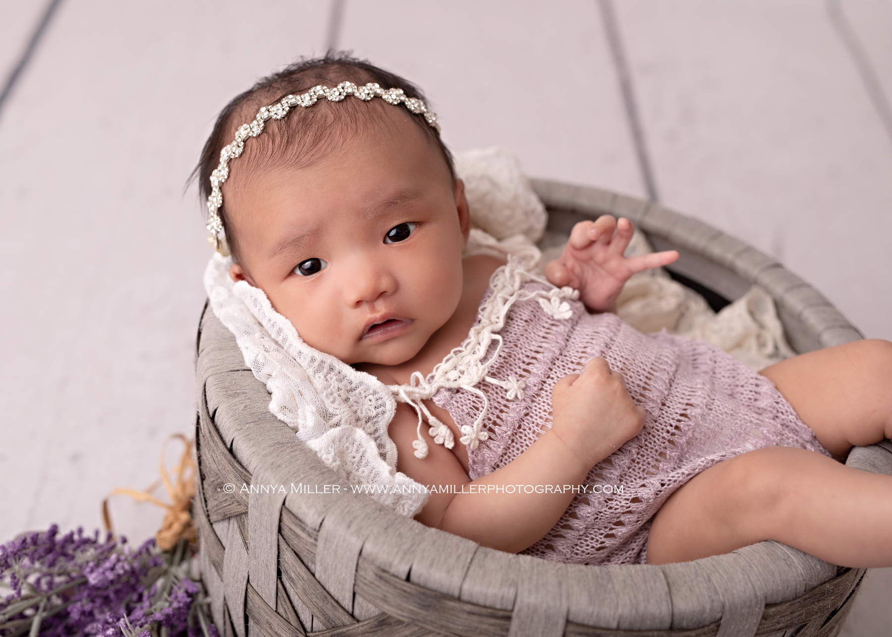 Awake baby girl at one month old, in studio for GTA newborn portraits by Annya Miller 