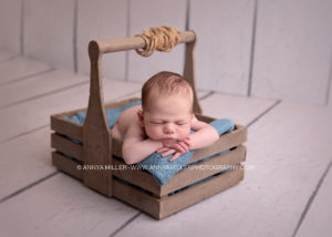 Portraits of baby boy sleeping in rustic crate by ajax newborn photographer Annya miller