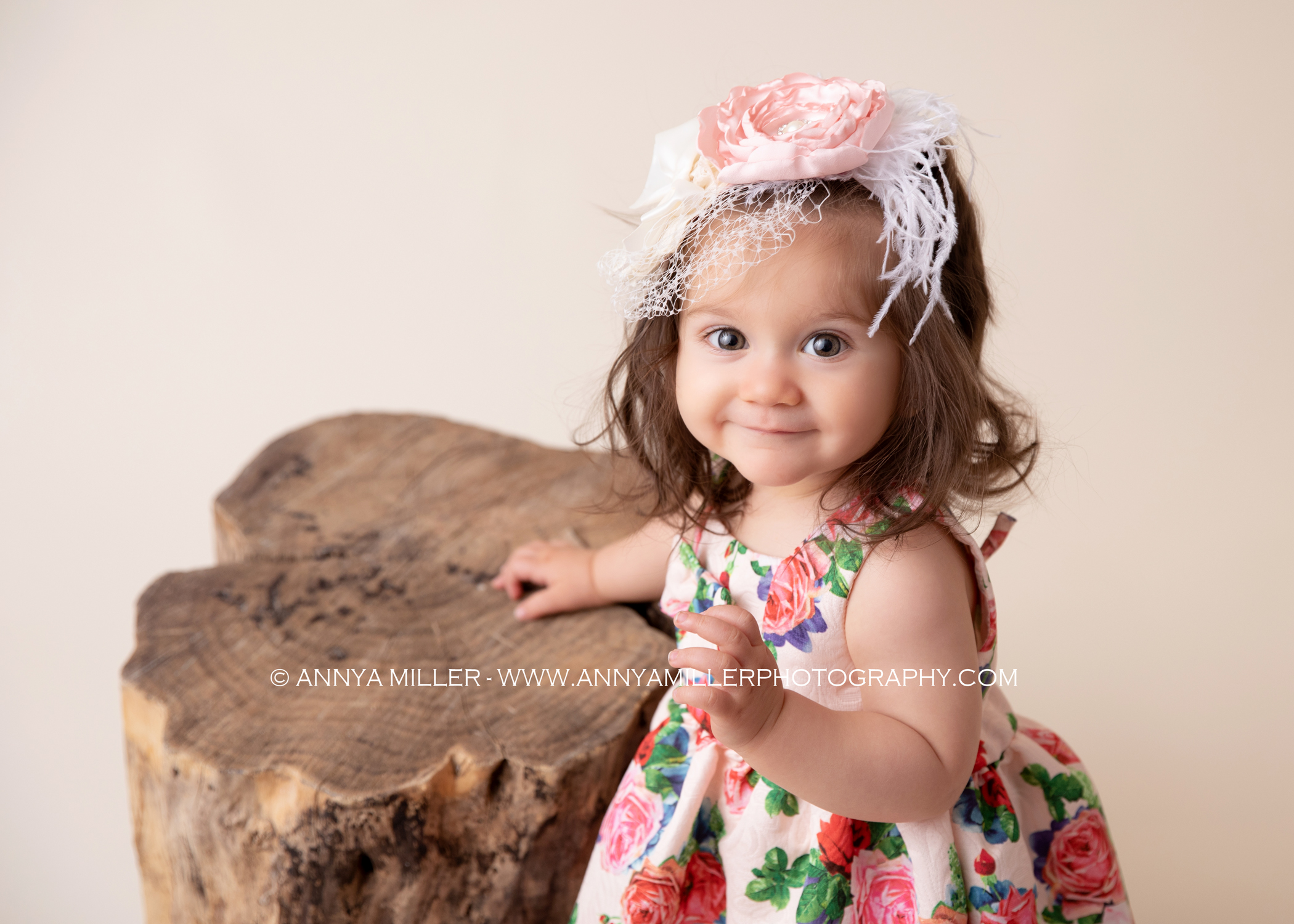First birthday portraits of baby girl in floral dress
