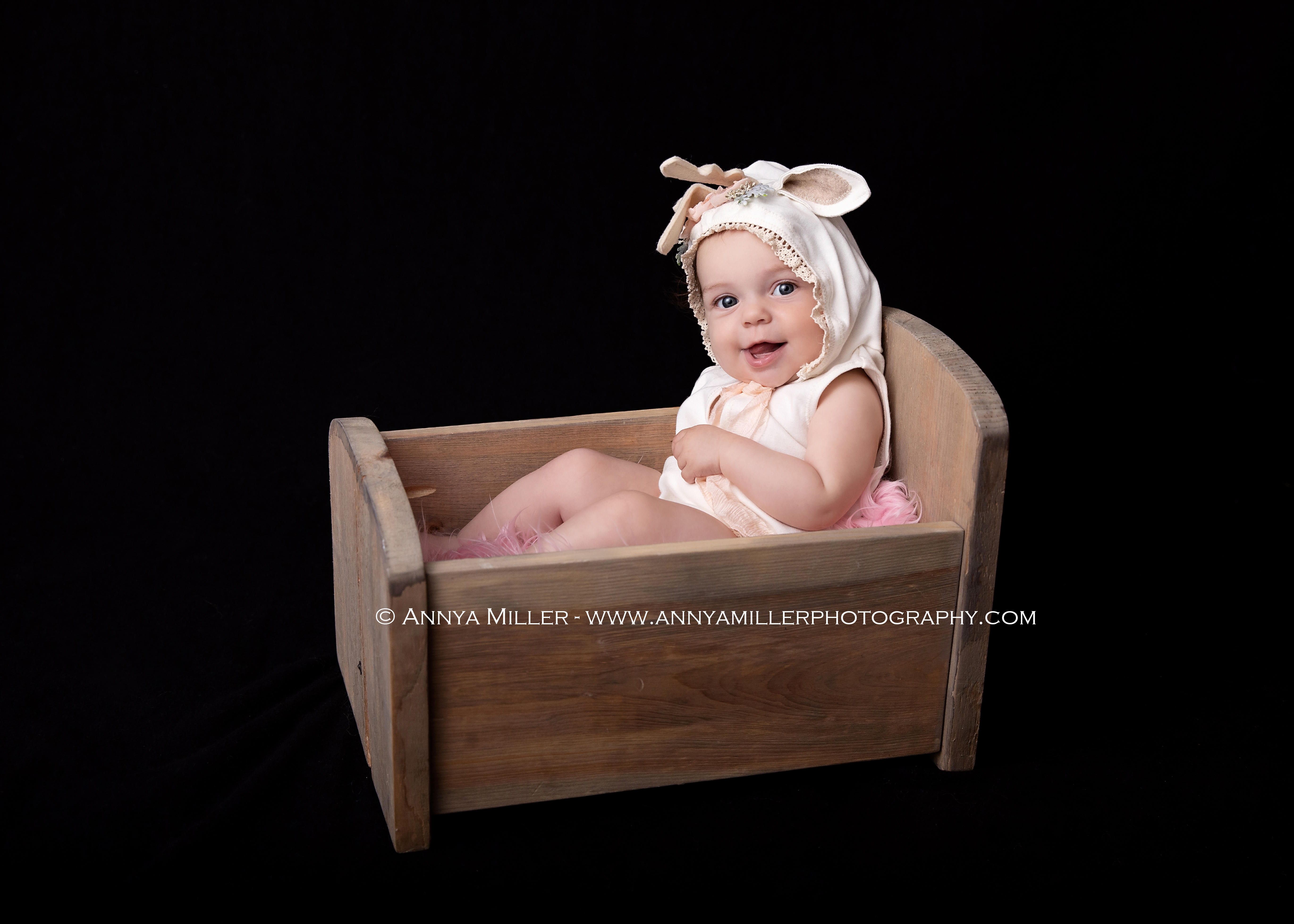 Portraits of baby girl in pearls and tutu by Durham baby photographer Annya Miller of Pickering