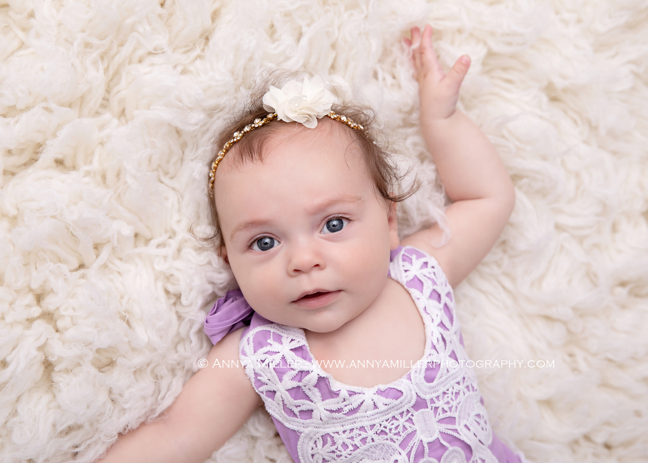 Portraits of baby girl in lace romper by Durham baby photographer Annya Miller of Pickering