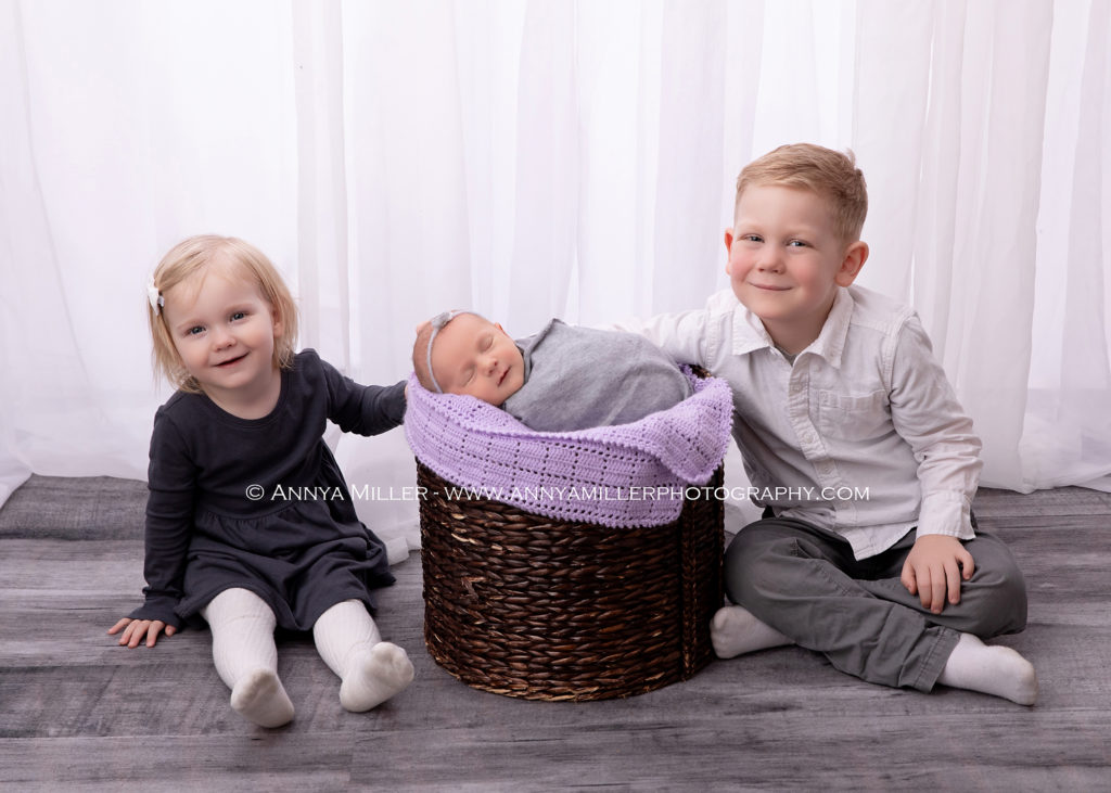 Newborn portrait of baby girl and siblings by Pickering photographer Annya Miller